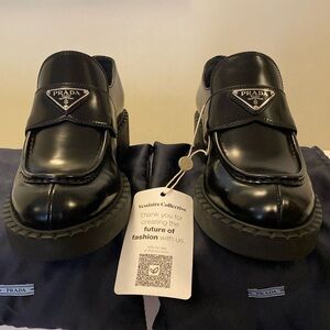 Prada Spazzolato Metal Triangle Loafers in black EU41